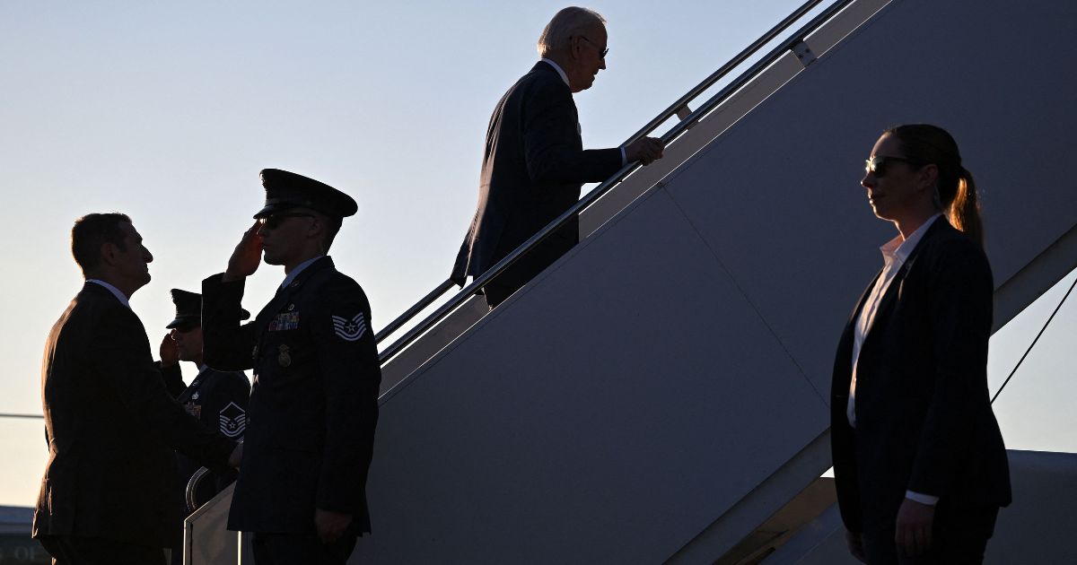 President Joe Biden climbs the stairs to Air Force One at Maxwell Air Force Base, Alabama, after speaking in Selma on Sunday.