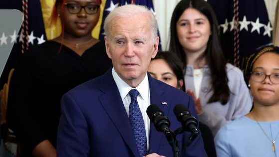 President Joe Biden speaks during a reception for Women's History Month at the White House on Wednesday.