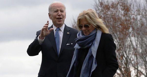 President Joe Biden, left, and first lady Jill Biden, right, walk on the South Lawn of the White House in Washington, D.C., on Jan. 23.