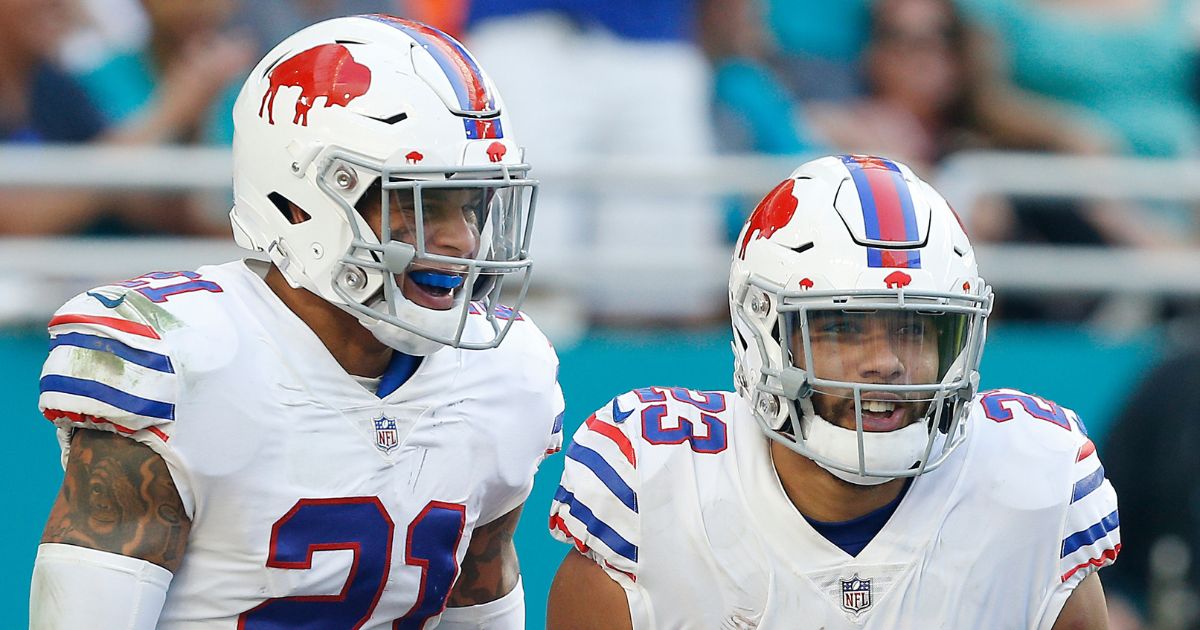 Buffalo Bills players Jordan Poyer, left, and Micah Hyde, right, celebrate after an interception against the Miami Dolphins in Miami, Florida, on Dec. 2, 2018.