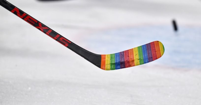 A hockey stick is wrapped in rainbow tape for an LGBT "pride" night for the game between the Montreal Canadiens and the Washington Capitals in Montreal, Canada, on April 16, 2022.