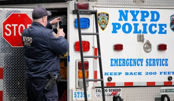 New York Police Department officers of the emergency service unit arrive at the courthouse Friday after powder was found in an envelope marked “Alvin” in a mailroom at the offices of Manhattan District Attorney Alvin Bragg.
