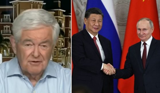 Newt Gingrich appears on Fox News on Tuesday. Russian President Vladimir Putin and Chinese President Xi Jinping shake hands at the Kremlin in Moscow on Tuesday.