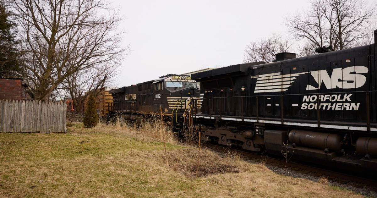 A Norfolk Southern train is traveling through East Palestine, Ohio, on Feb. 14. (Angelo Merendino / Getty Images)