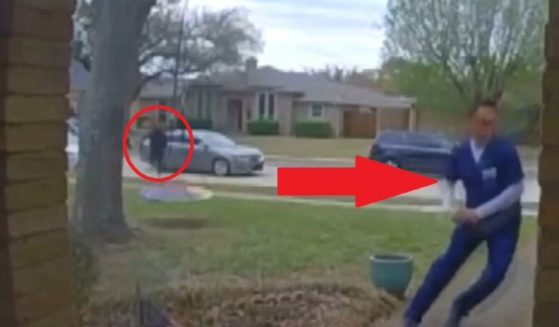 The man made a dash for his backyard when he saw someone charging aggressively at him.