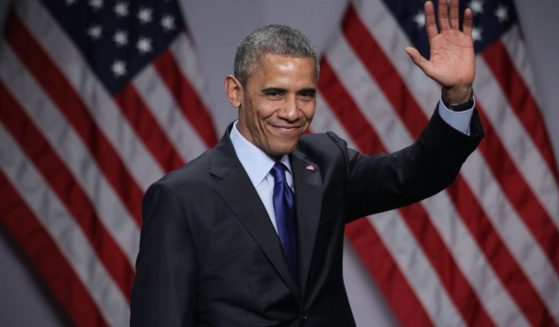 Then-President Barack Obama waves after speaking on March 23, 2015, in National Harbor, Maryland.
