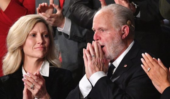 Famed conservative radio host Rush Limbaugh, alongside his wife, Kathryn Limbaugh, receives an ovation after being awarded the Medal of Freedom by then-President Donald Trump during the State of the Union address at the Capitol in Washington on Feb. 4, 2020.
