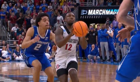 Creighton guard Ryan Nembhard, left, was called for a foul on San Diego State's Darrion Trammell on this play in the NCAA Tournament on Sunday.