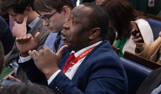 Today News Africa reporter Simon Ateba asks White House press secretary Karine Jean-Pierre a question before the daily White House briefing on March 20.