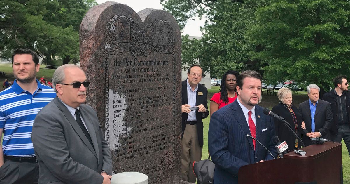 In a file photo from April 2018, Arkansas Republican state Sen. Jason Rapert speaks at the unveiling of a Ten Commandments monument outside the Arkansas state Capitol in Little Rock. Opponents of the privately funded display argue it's an unconstitutional endorsement of religion by government and are seeking its removal.