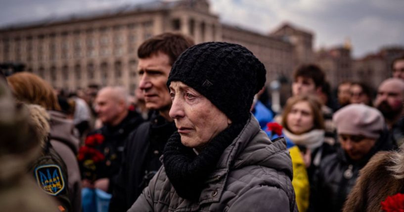 People attend a ceremony for slain Ukrainian volunteers in Kyiv on Tuesday.