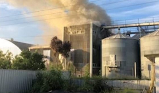 Smoke billows from the Corson Grain Mill in Gisborne, New Zealand, on Thursday.