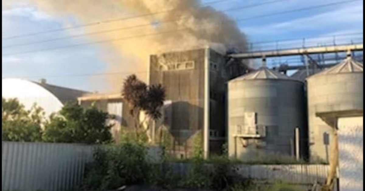 Smoke billows from the Corson Grain Mill in Gisborne, New Zealand, on Thursday.