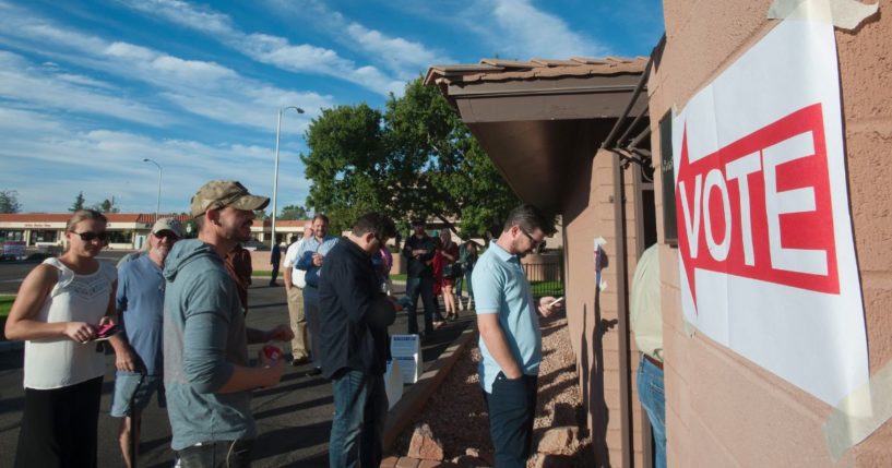 Voters wait in line to cast their ballots at a polling station in Scottsdale, Arizona, on Nov. 8, 2016.