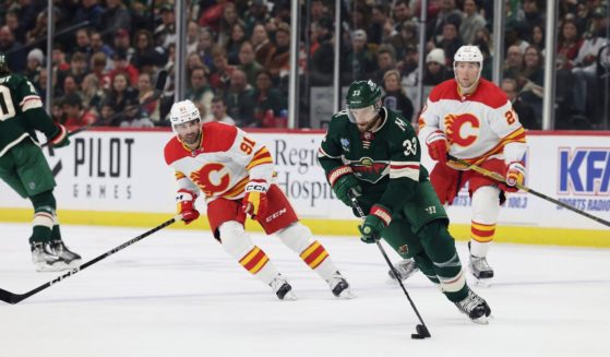 Minnesota Wild defenseman Alex Goligoski works with the puck during the second period of the team's game against the Calgary Flames in St. Paul, Minnesota, on Tuesday.