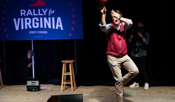 Virginia Gov. Glenn Youngkin shoots basketballs at supporters during a rally for Yesli Vega, Republican candidate for northern Virginias 7th Congressional District, in Triangle, Virginia, on Nov. 7, 2022.
