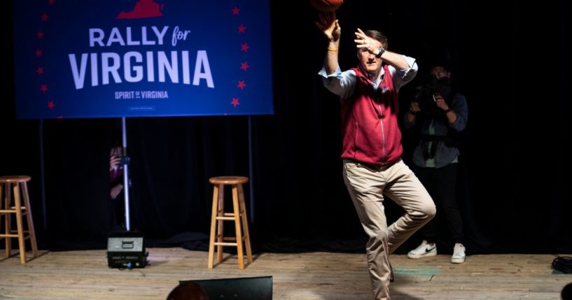 Virginia Gov. Glenn Youngkin shoots basketballs at supporters during a rally for Yesli Vega, Republican candidate for northern Virginias 7th Congressional District, in Triangle, Virginia, on Nov. 7, 2022.