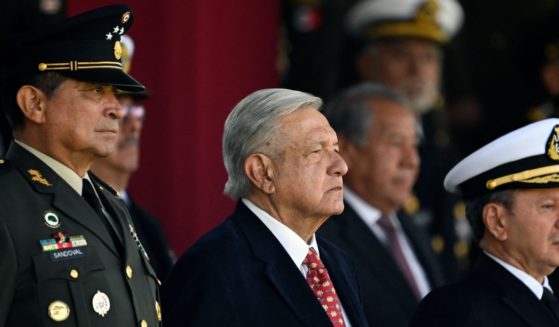 Mexican President Andres Manuel Lopez Obrador (C), Defense Minister Luis Cresencio Sandoval (L), and Secretary of the Mexican Navy, Jose Rafael Ojeda Duran, attend a ceremony for the National Flag Day at Campo Marte in Mexico City, on February 24, 2023.
