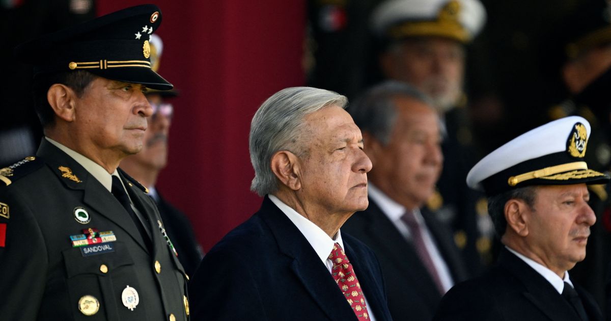 Mexican President Andres Manuel Lopez Obrador (C), Defense Minister Luis Cresencio Sandoval (L), and Secretary of the Mexican Navy, Jose Rafael Ojeda Duran, attend a ceremony for the National Flag Day at Campo Marte in Mexico City, on February 24, 2023.