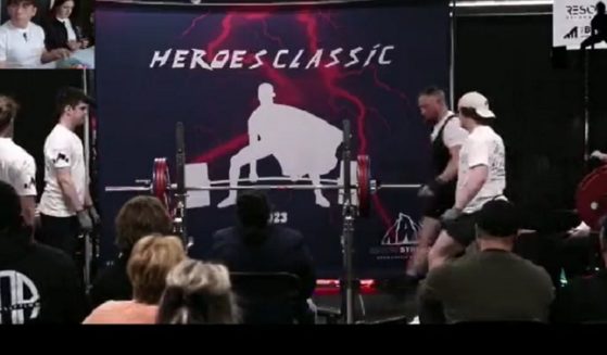 Powerlifter Avi Silverberg strides onto the stage Saturday at the Heroes Powerlifting Classic in Alberta, British Columbia.