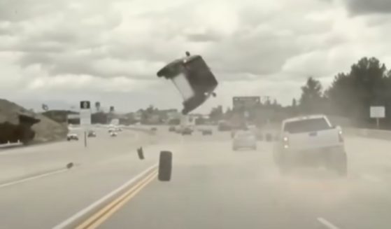 A Kia flipped over after hitting a tire in California on Thursday.