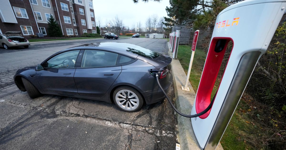 a Tesla sedan charging