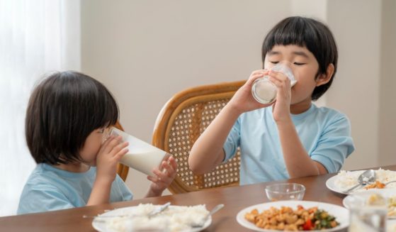 children drinking milk at a table