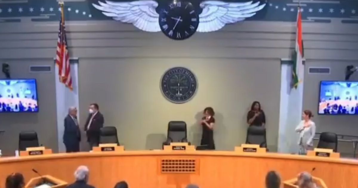 This Twitter screen shot shows a Miami-Dade County Commission meeting where Commissioner Sabina Covo did not appear to know the pledge of allegiance.