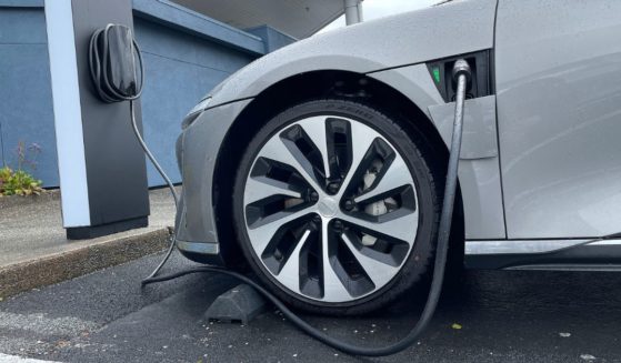 A Lucid electric vehicle sits parked at a charging station outside of a Lucid Studio on Wednesday in Corte Madera, California.