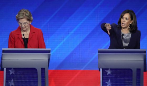 Sen. Elizabeth Warren (D-MA) and then-Sen. Kamala Harris (D-CA) interact on stage during the Democratic Presidential Debate at Texas Southern University's Health and PE Center on September 12, 2019 in Houston.