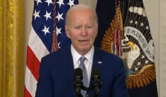 President Joe Biden struggles to read a poem from a teleprompter on Tuesday at the White House.