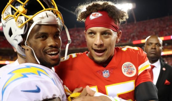 Los Angeles Charger Nasir Adderly, left, shakes hands with Kansas City Chiefs quarterback Patrick Mahomes in a September file photo after the Chiefs defeated the Chargers at Arrowhead Stadium in Kansas City, Missouri.