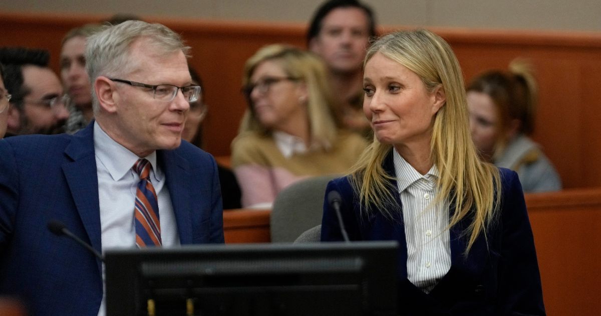 Actor Gwyneth Paltrow and attorney Steve Owens react as the verdict is read in her civil trial over a collision with another skier on March 30, 2023, in Park City, Utah.