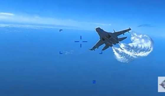 Video released by the Pentagon shows a Russin jet approaching a U.S. drone over the Black Sea.