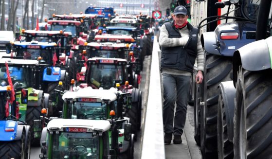 Farmers with their tractors block traffic