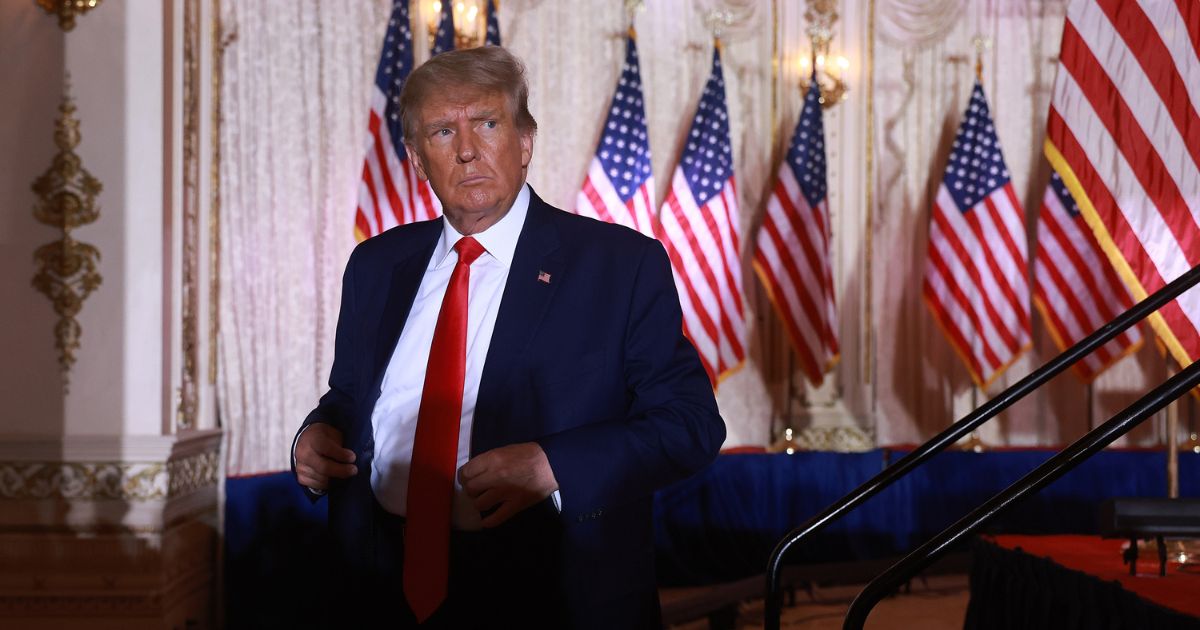 Former U.S. President Donald Trump leaves the stage after speaking during an event at his Mar-a-Lago home on November 15, 2022 in Palm Beach, Florida.