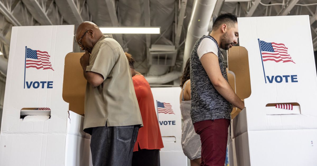 People vote in the above stock image.