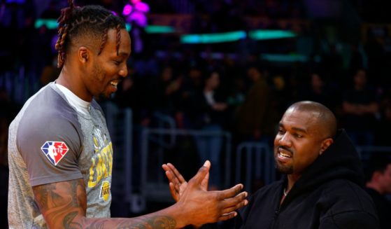 Rapper Kanye West and Dwight Howard #39 of the Los Angeles Lakers at Crypto.com Arena on March 11, 2022 in Los Angeles.