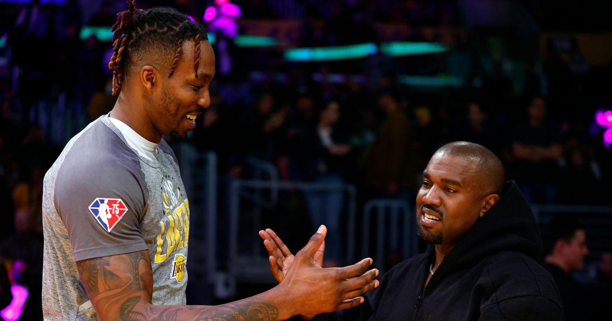 Rapper Kanye West and Dwight Howard #39 of the Los Angeles Lakers at Crypto.com Arena on March 11, 2022 in Los Angeles.