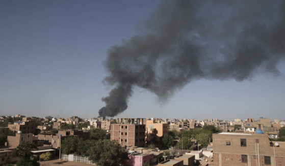 black smoke rising over Khartoum, Sudan