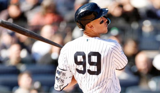 Aaron Judge #99 of the New York Yankees bats during the seventh inning against the San Francisco Giants on Opening Day at Yankee Stadium on Thursday in the Bronx borough of New York City.