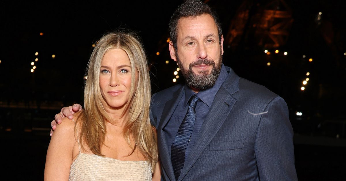Jennifer Aniston, left, and Adam Sandler, right, attend the "Murder Mystery 2" photocall in Paris, France, on March 16.