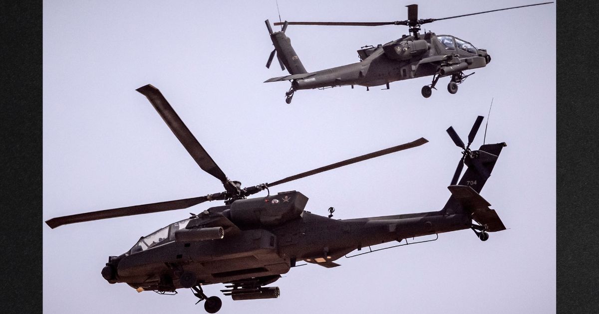 U.S. Army AH-64 Apache attack helicopters are seen flying over southwestern Morocco in this file photo from June 2022.