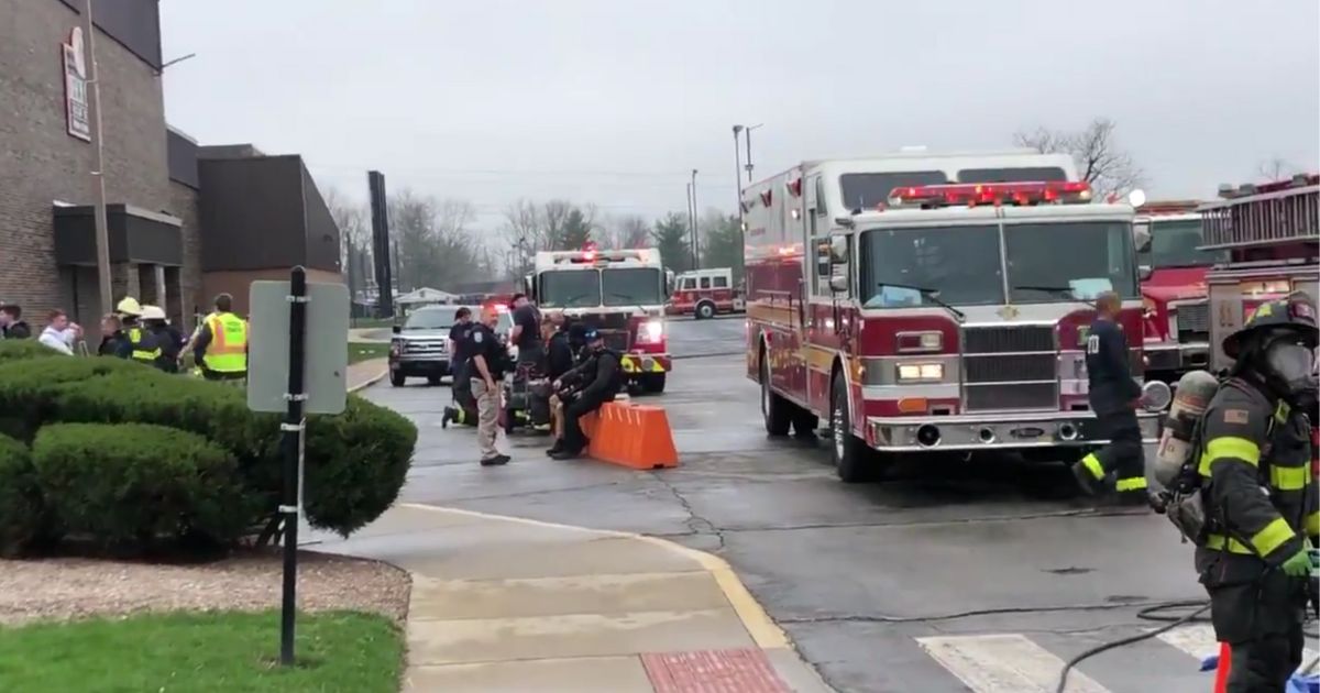 Emergency personnel responding to a reported chemical spill
