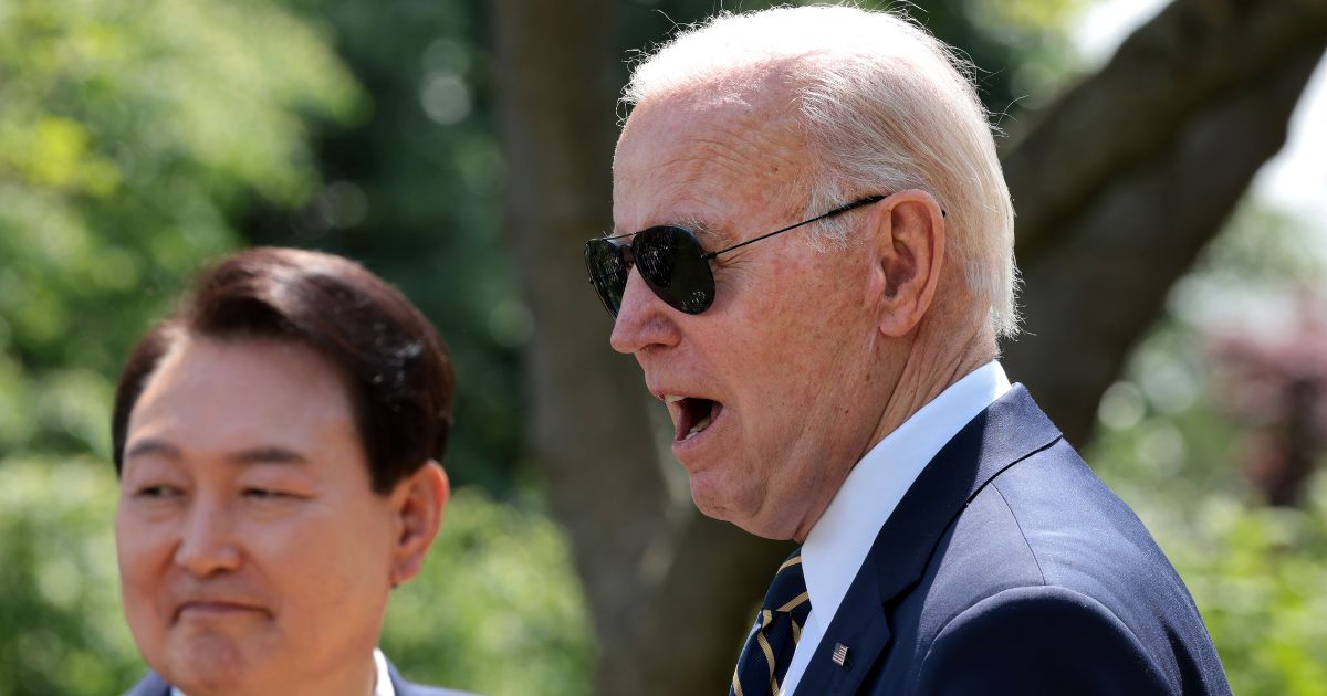 President Joe Biden, right, responds to a reporter's question during a joint news conference with South Korean President Yoon Suk Yeol in the Rose Garden at the White House in Washington on Wednesday.