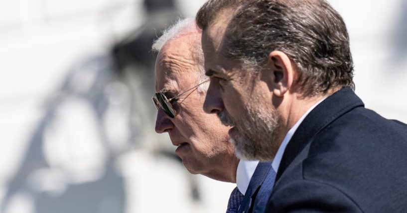 President Joe Biden and his son Hunter Biden are seen on the South Lawn of the White House on April 10 in Washington, D.C.
