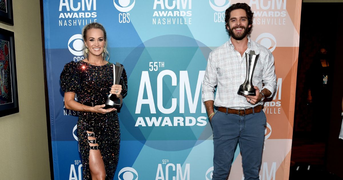 Carrie Underwood and Thomas Rhett pose with their Entertainer of the Year awards at the 55th Academy of Country Music Awards at the Grand Ole Opry on September 16, 2020 in Nashville, Tennessee. (John Shearer / Getty Images)