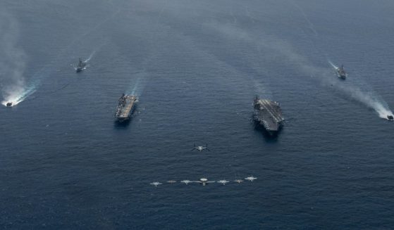 Ships and aircraft from Nimitz Carrier Strike Group and Makin Island Amphibious Ready Group operate in formation in the South China Sea in February.