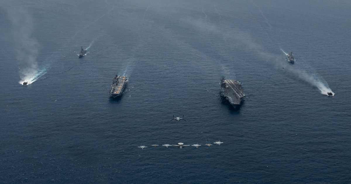 Ships and aircraft from Nimitz Carrier Strike Group and Makin Island Amphibious Ready Group operate in formation in the South China Sea in February.