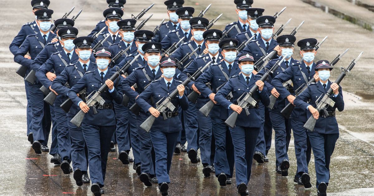Police officers perform a new goose-stepping march, the same style used by police and troops on the Chinese mainland, at the city's police college during an open day to mark the National Security Education Day in Hong Kong on April 15, 2021.